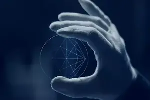 A hand wearing a white glove holds a glass disk with a geometric pattern on a blue background.