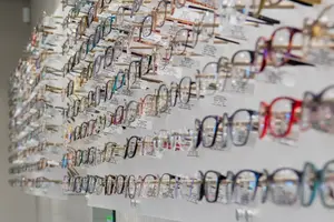 A wall with many glasses hanging on it