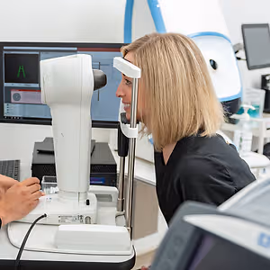 happy female eye exam close up