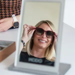 female fitting luxury sunglasses