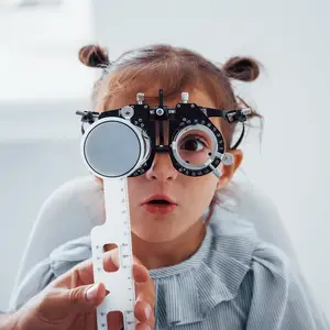 young girl close up eye exam
