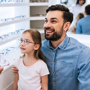 young girl smiling fitting eyewear