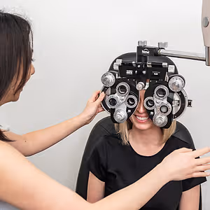 happy female smiling eye exam
