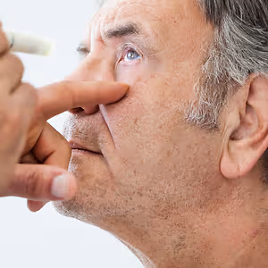 elderly man examined by an ophthalmologist