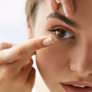 vision contact lenses. closeup with beautiful woman face