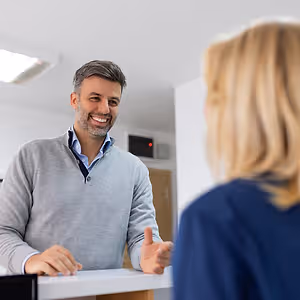 man scheduling eye exam
