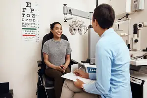 An eye doctor is examining a patient at the eye clinic.