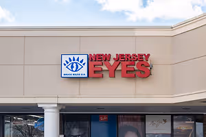 Exterior of a business called New Jersey Eyes with a sign with a red background and white and blue logo