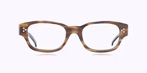 Square-shaped brown eyeglasses with a tortoiseshell pattern and white dots on the temples