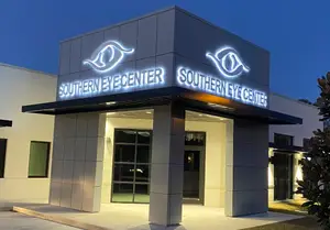Southern Eye Center building entrance with illuminated sign at night