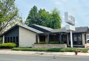 An exterior view of the Southern Eye Center with a fire hydrant on the side of the road.