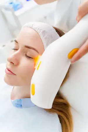 woman getting laser treatment on her face