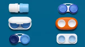 Six contact lens cases, in white, blue, and orange, on a blue background.