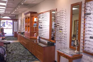 Auburn Family Optometry eyeglasses displayed on the wall