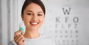 Woman holding contact lens case 