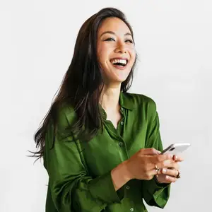 A happy woman holding a smart phone
