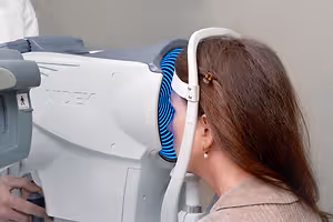woman getting her eyes checked at an eye exam
