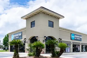 Perspective Eye Center store exterior with palm trees and street lamps
