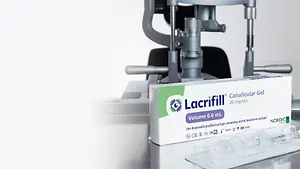 Lacrifill Canalicular Gel is packed in a white box with green and purple detailing, placed on a table next to a medical device.