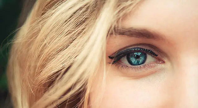 Close up of a woman with blonde hair and blue eyes